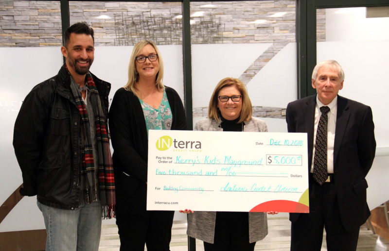 THE CEREMONIAL CHECK, representing the $5,000 DONATION to Kerry’s Kids Playground at Hay Park in Goshen, was presented by Interra Credit Union to Mayor Jeremy Stutsman, left, and Tanya Heyde, the superintendent of Parks and Recreation, from Interra CEO Amy Sink and Tim Yoder, Chairman of the Board.