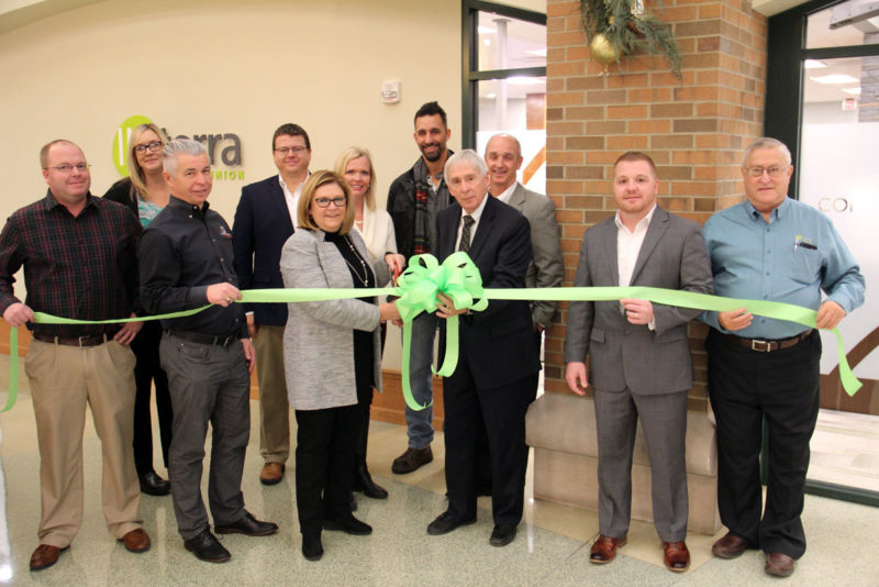 CUTTING THE RIBBON to celebrate the Interra’s major corporate office renovation were, from left, Jason Pippenger, president of DJ Construction; Tanya Heyde, superintendent of Goshen Parks and Recreation, Bob Schrock, CEO, DJ Construction; Nick Kiefer, President of Goshen Chamber of Commerce; Amy Sink, Interra CEO; Susan Cripe, Interra Supervisory Committee member; Goshen Mayor Jeremy Stutsman; Tim Yoder, Chairman of the Board; David Birky, Executive Vice President/Chief Strategy Officer; Andy Marshall, Executive Vice President/Chief Operating Officer; and Loren Eash, board member.